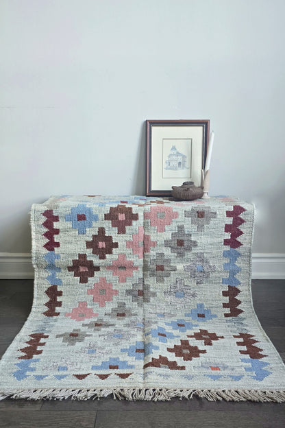 Decorative rug with geometric pattern on a plain background